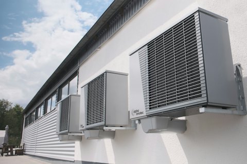 Air-conditioning heat-pump units mounted on a white wall