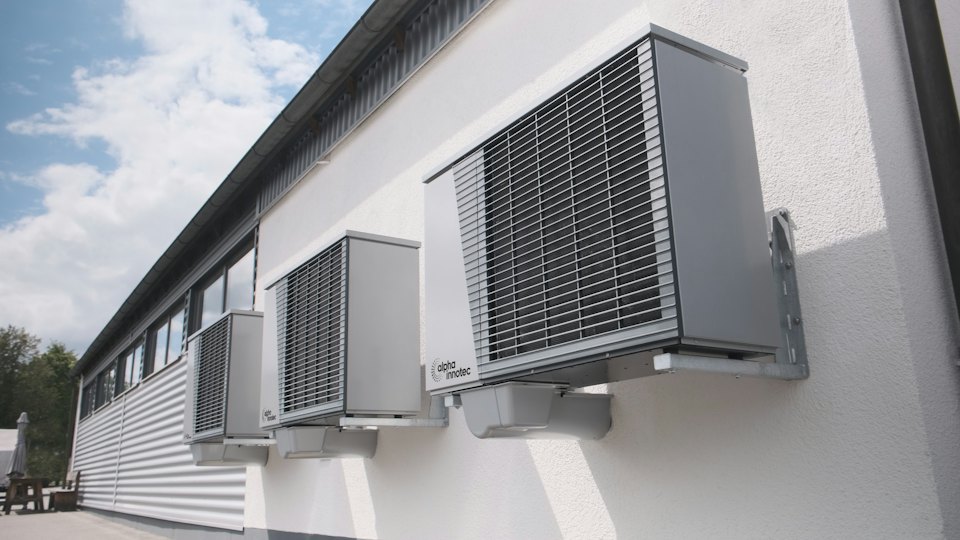Air-conditioning heat-pump units mounted on a white wall