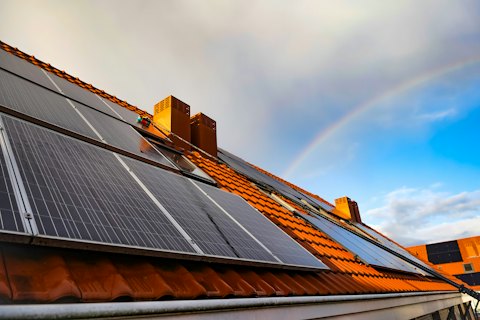 Solar panels on a terracotta-tiled roof